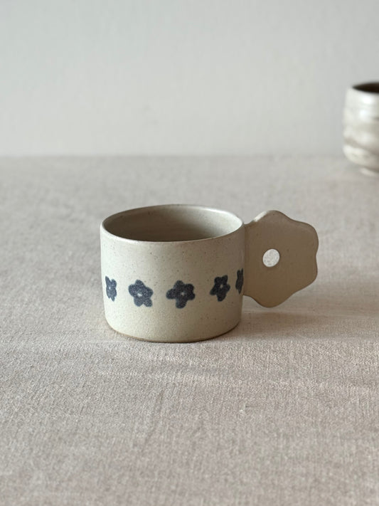Mug with a flower handle