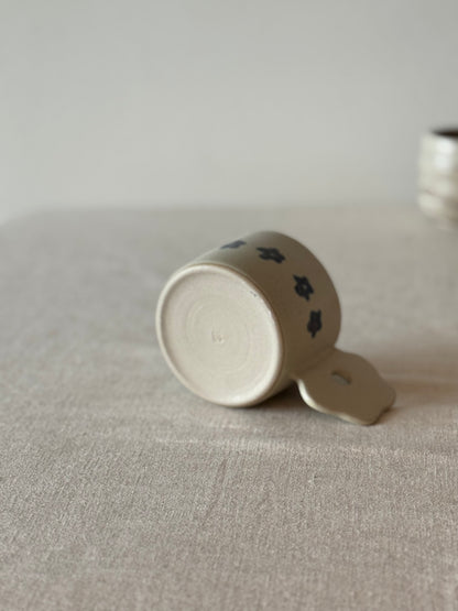 Mug with a flower handle