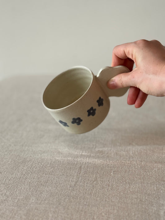 Mug with a flower handle